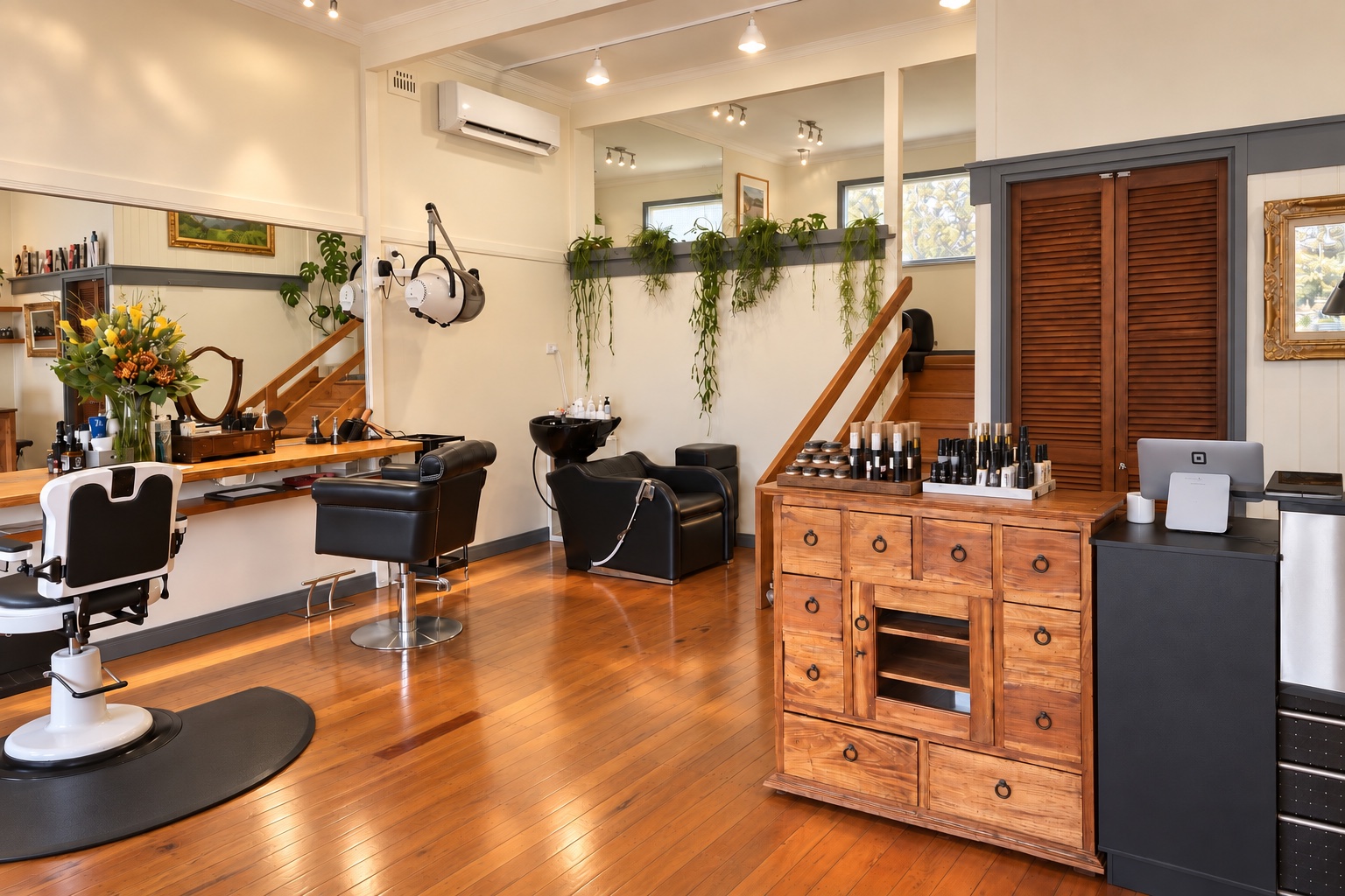 View of the salon reception and styling area, with lighting and window treatments adjusted
